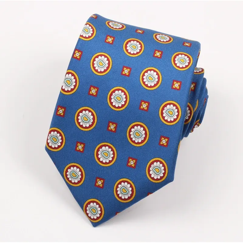 Blue tie with repeated round yellow, red and white emblems.