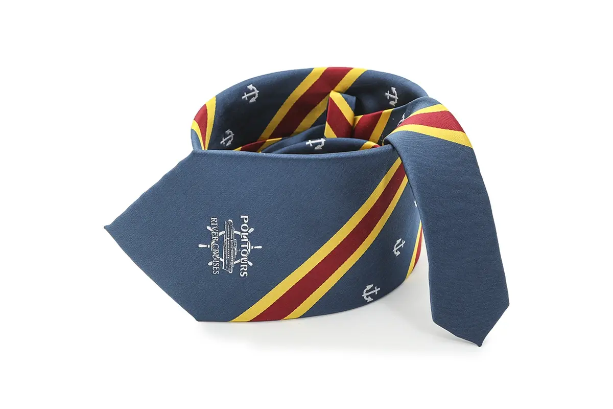 Navy tie with white crest, small anchor motifs and red and yellow diagonal.