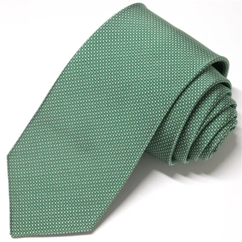 Green textured necktie on white background