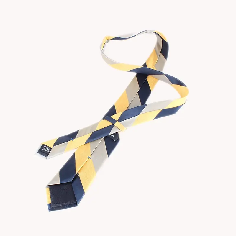 Yellow and navy striped tie to show the blade, neck section and reverse tip.