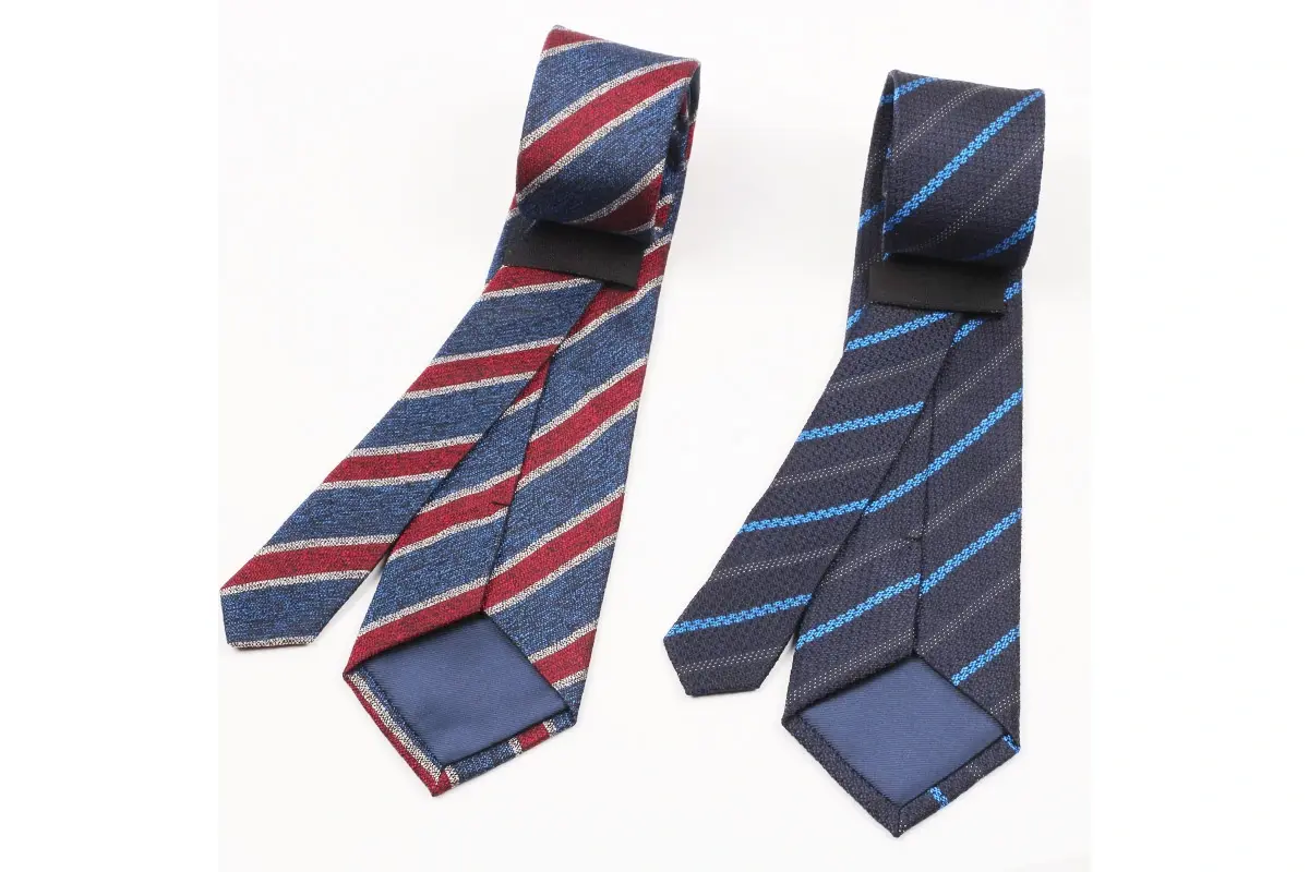 Two striped tie designs with red and blue colors with front and reverse views.