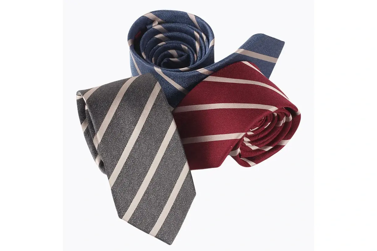 Gray, navy and burgundy rolled ties with coordinated pale diagonal stripes.