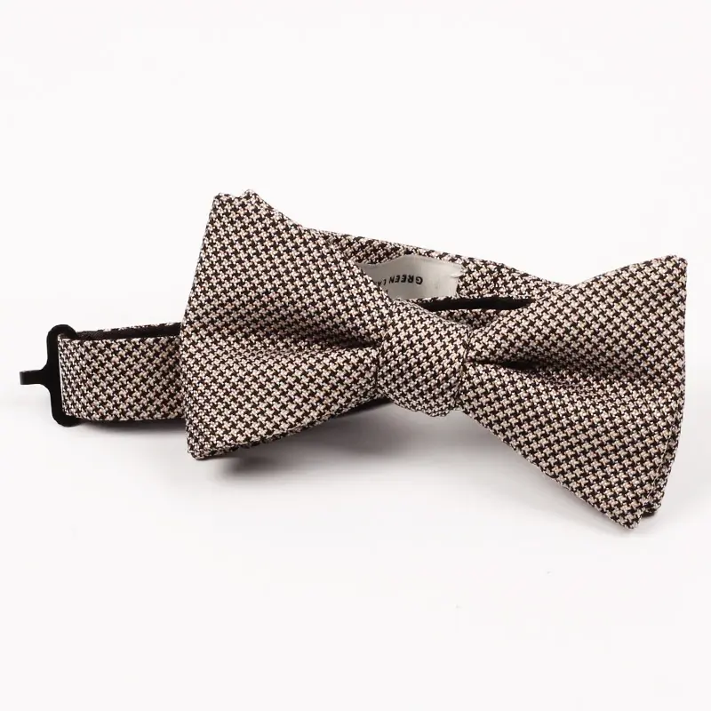 Beige patterned bow tie with an adjustable strap