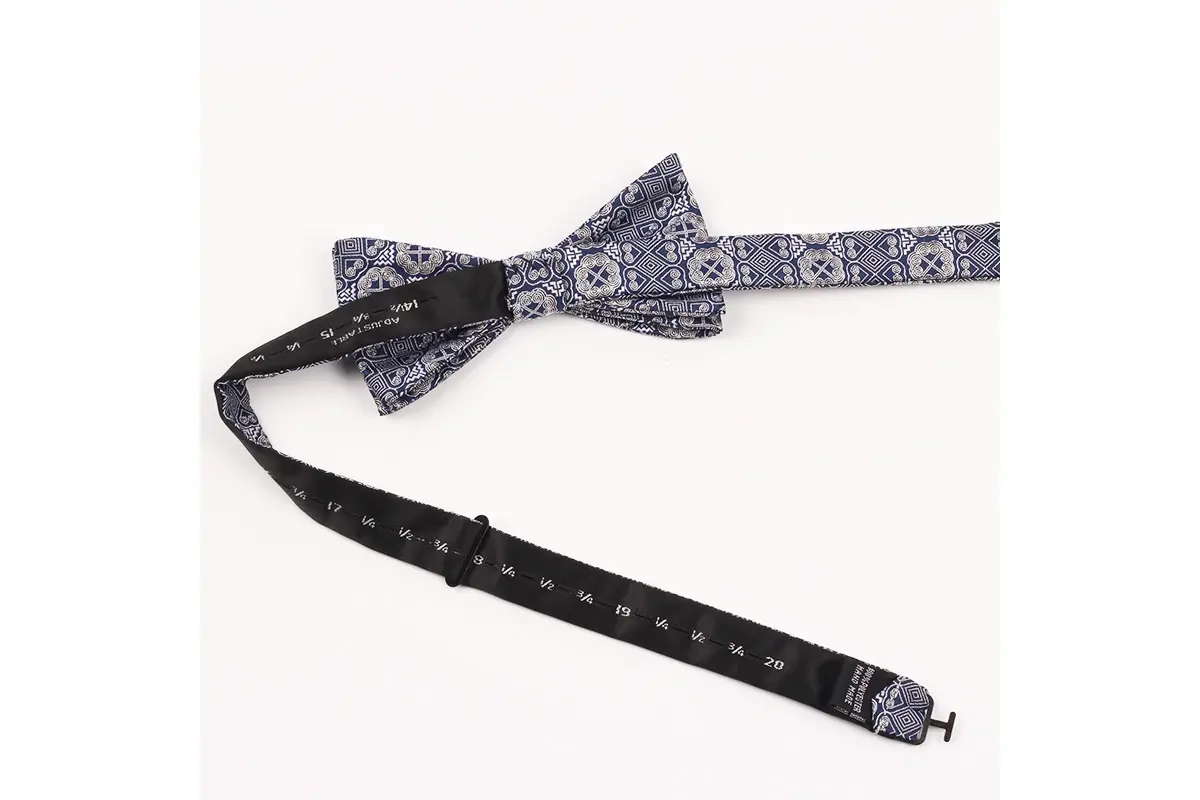 Purple and gray patterned self-tie bow with an adjustable numbered neck band.