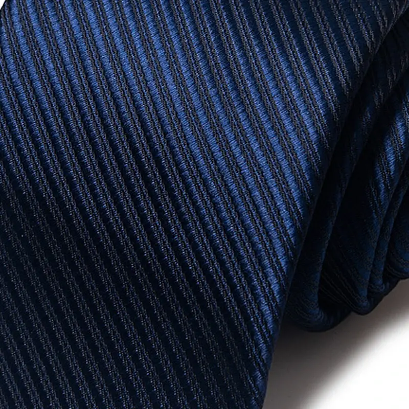 Close-up of dark necktie with fine diagonal texture