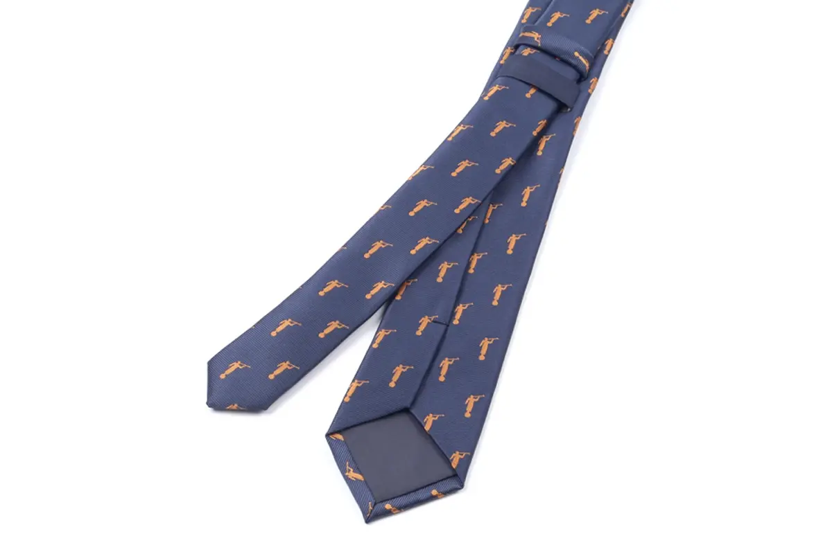 Navy motif tie with wide blade, narrow tail and reverse tipping.