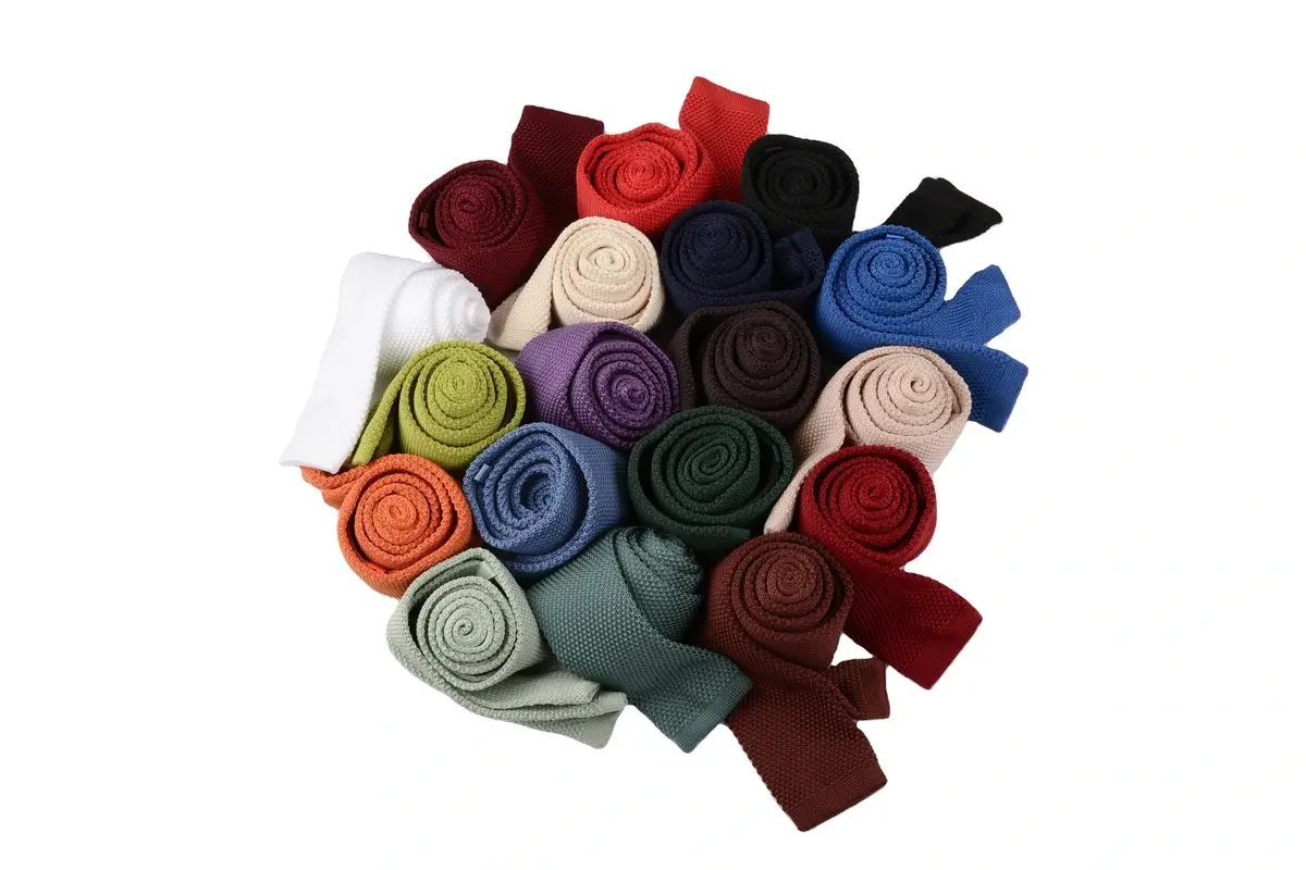 Rolled plain ties in range of red, blue, green, purple.