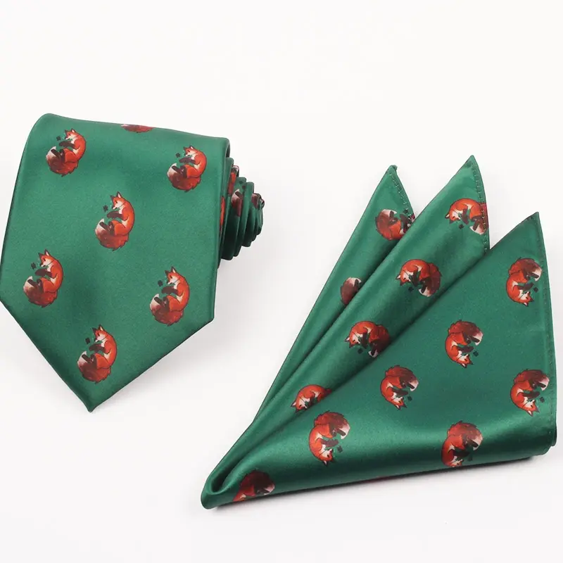 Green printed tie and matching pocket square with repeated red fox motifs.