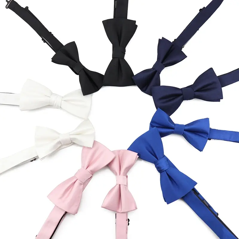 Pre-tied bow ties in black, white, pink, navy and blue on white.