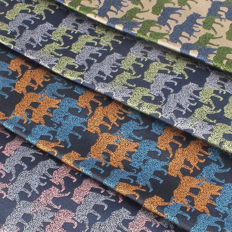 Four woven fabrics in green, blue, orange and pink with repeated animal motifs.