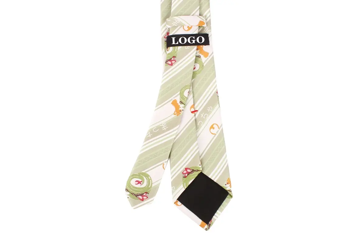 Reverse of a pale green patterned tie with a black sample LOGO hang tag.