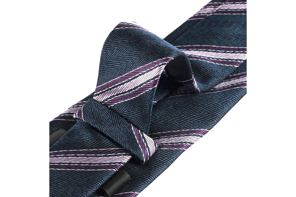 Close view of a navy and purple striped tie tied in a finished knot.