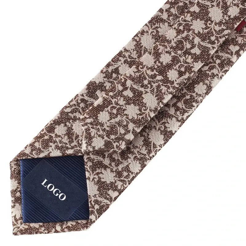 Brown floral tie reverse with a navy sample LOGO label.