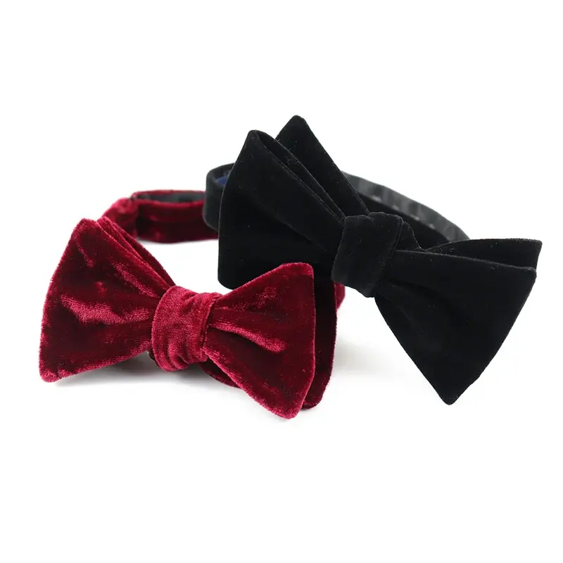 Red and black velvet bow ties shown together on a white background.