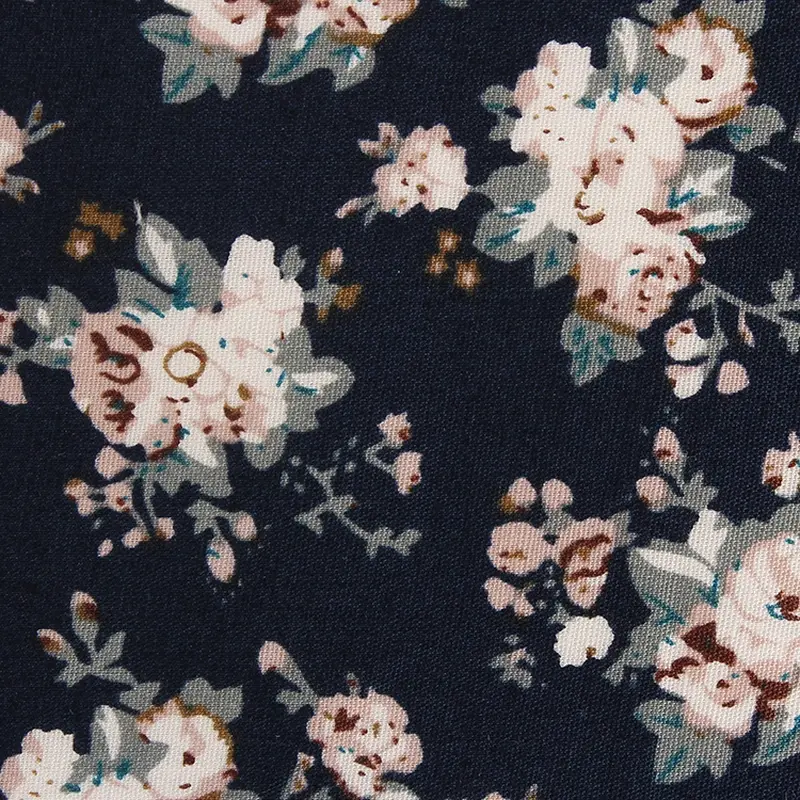 Navy fabric with a repeated pale floral pattern.