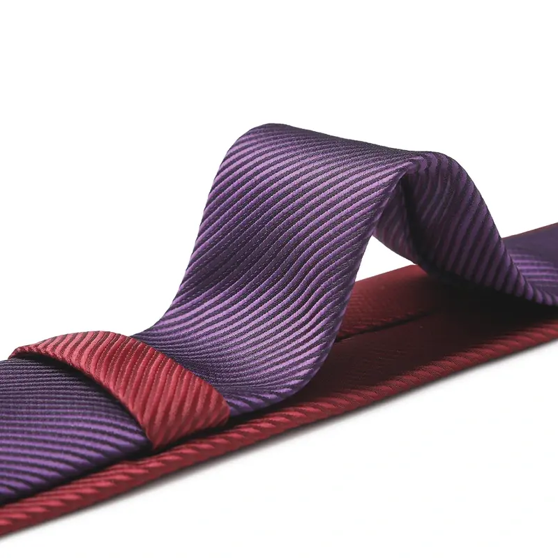 Purple and burgundy striped tie displayed in a finished knot.